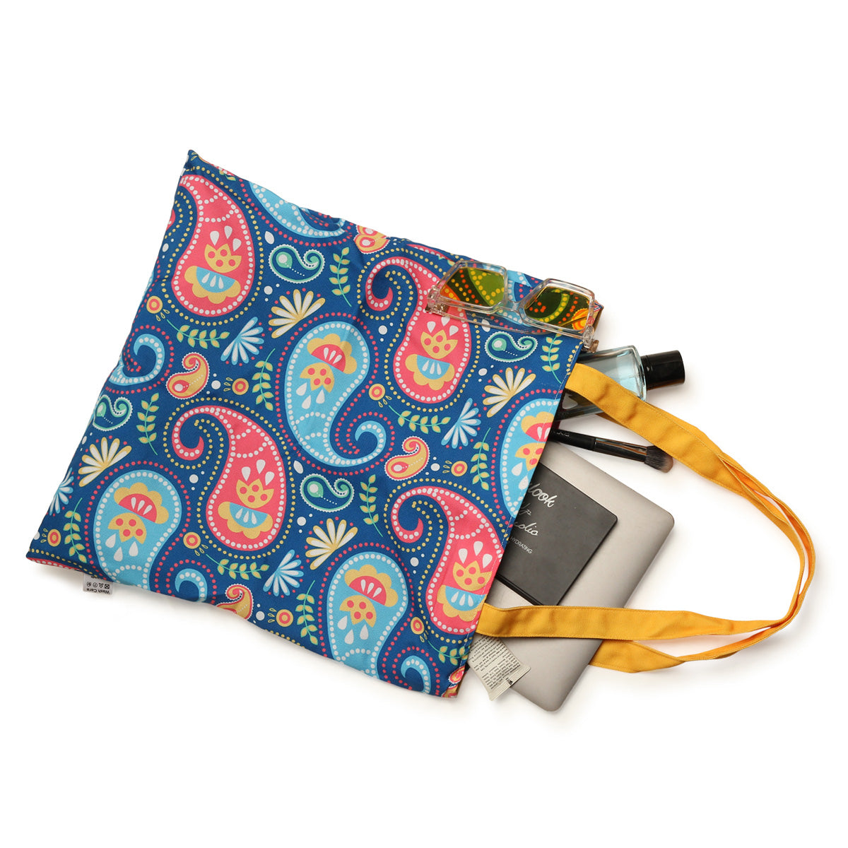 A tote bag adorned with a colorful and intricate paisley pattern.