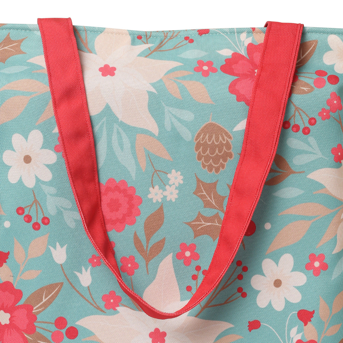 A stylish tote bag adorned with a colorful floral print and complemented by bold red handles, ideal for carrying essentials.