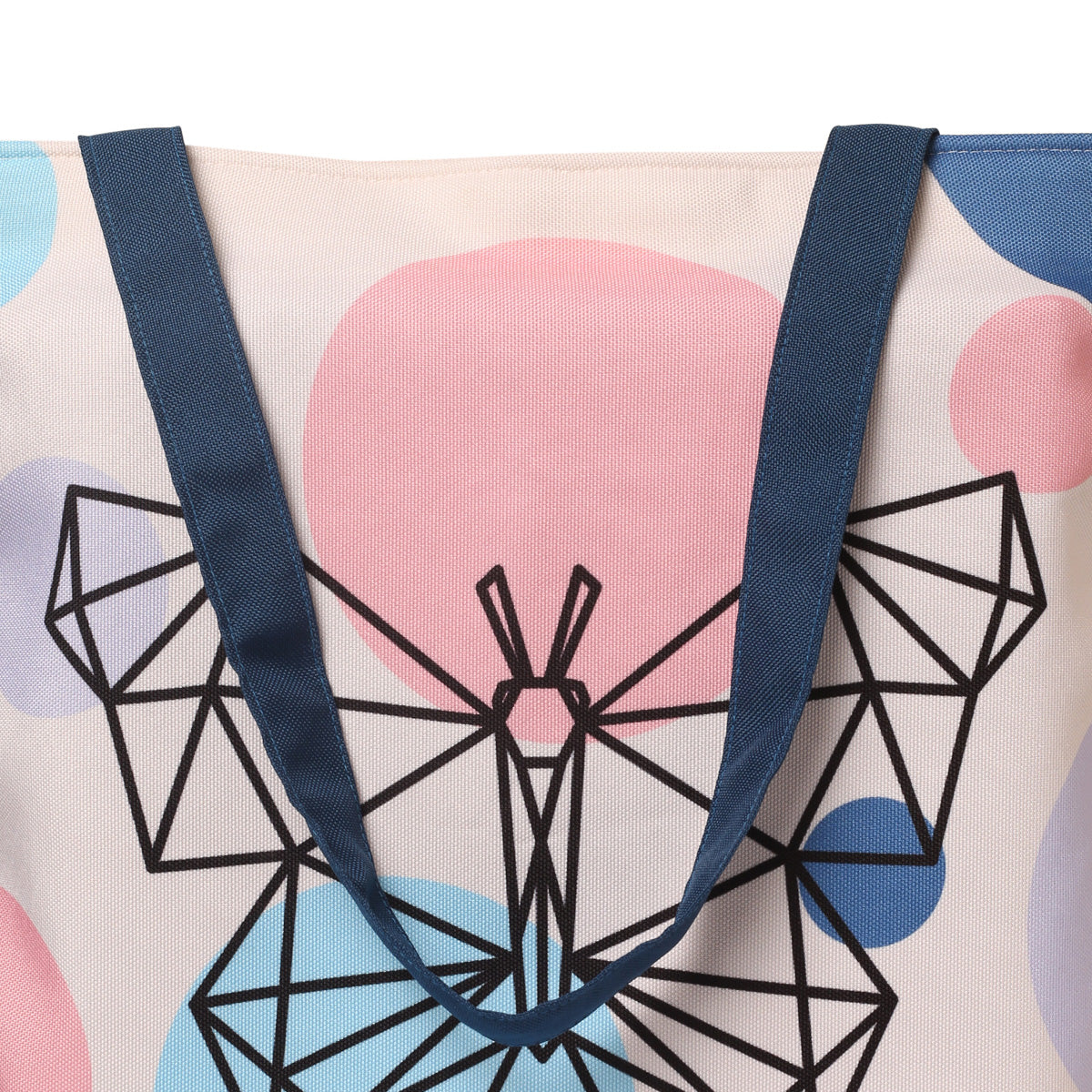  A unique tote bag decorated with bold geometric designs and a charming butterfly, perfect for a fun and stylish look.