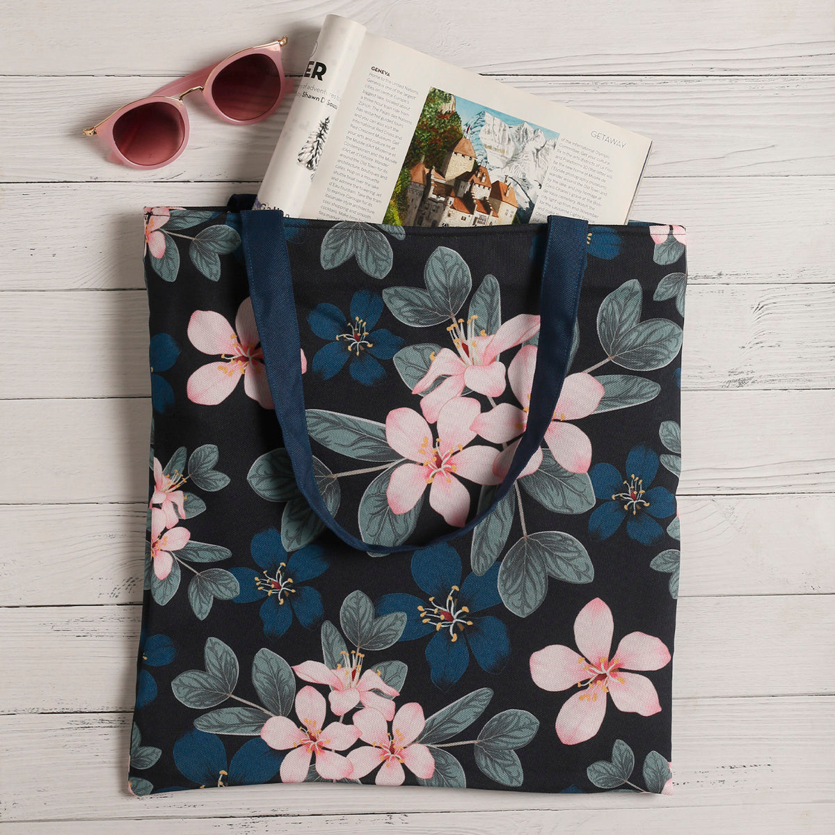 Stylish tote bag with vibrant floral print, perfect for carrying essentials on a sunny day out.