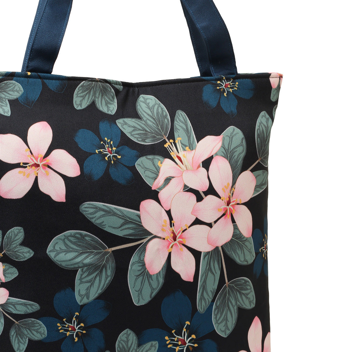 A fashionable tote bag featuring a bold floral pattern.