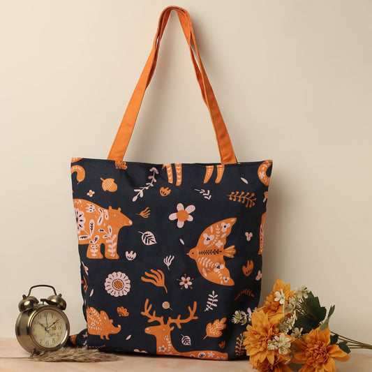 Tote bag with orange handle, featuring a deer and flowers design.