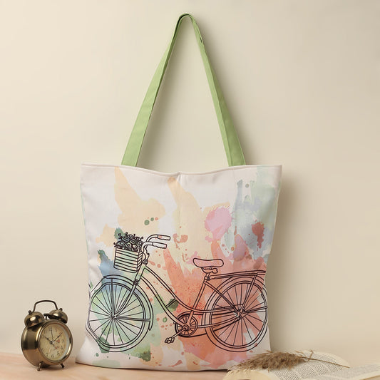 Tote Bags with pastel color print of cute vintage cycle with a green handle complimenting the overall design of the tote bag.