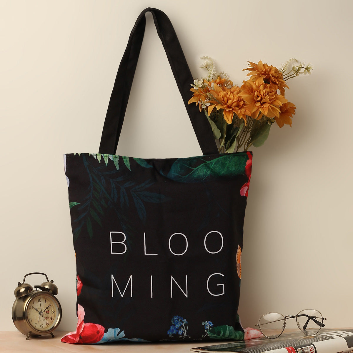 Colorful floral tote bag with vibrant blooms, perfect for adding a pop of color to your outfit.