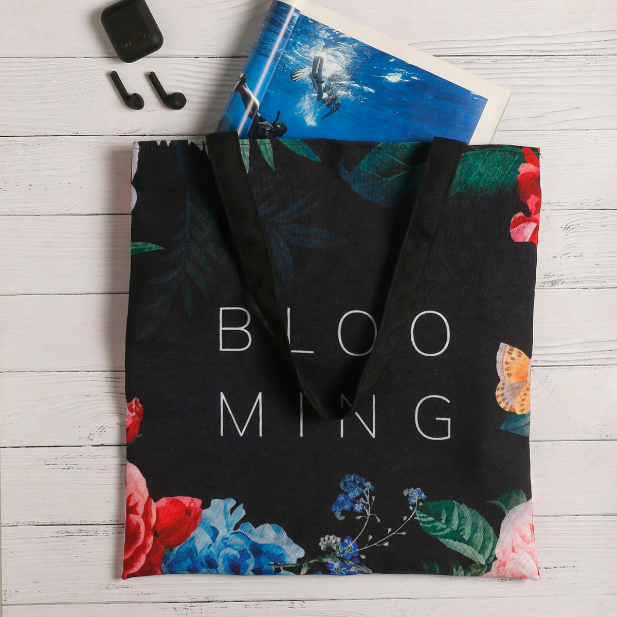 A tote bag featuring a beautiful array of blooming flowers, adding a touch of nature to your style.