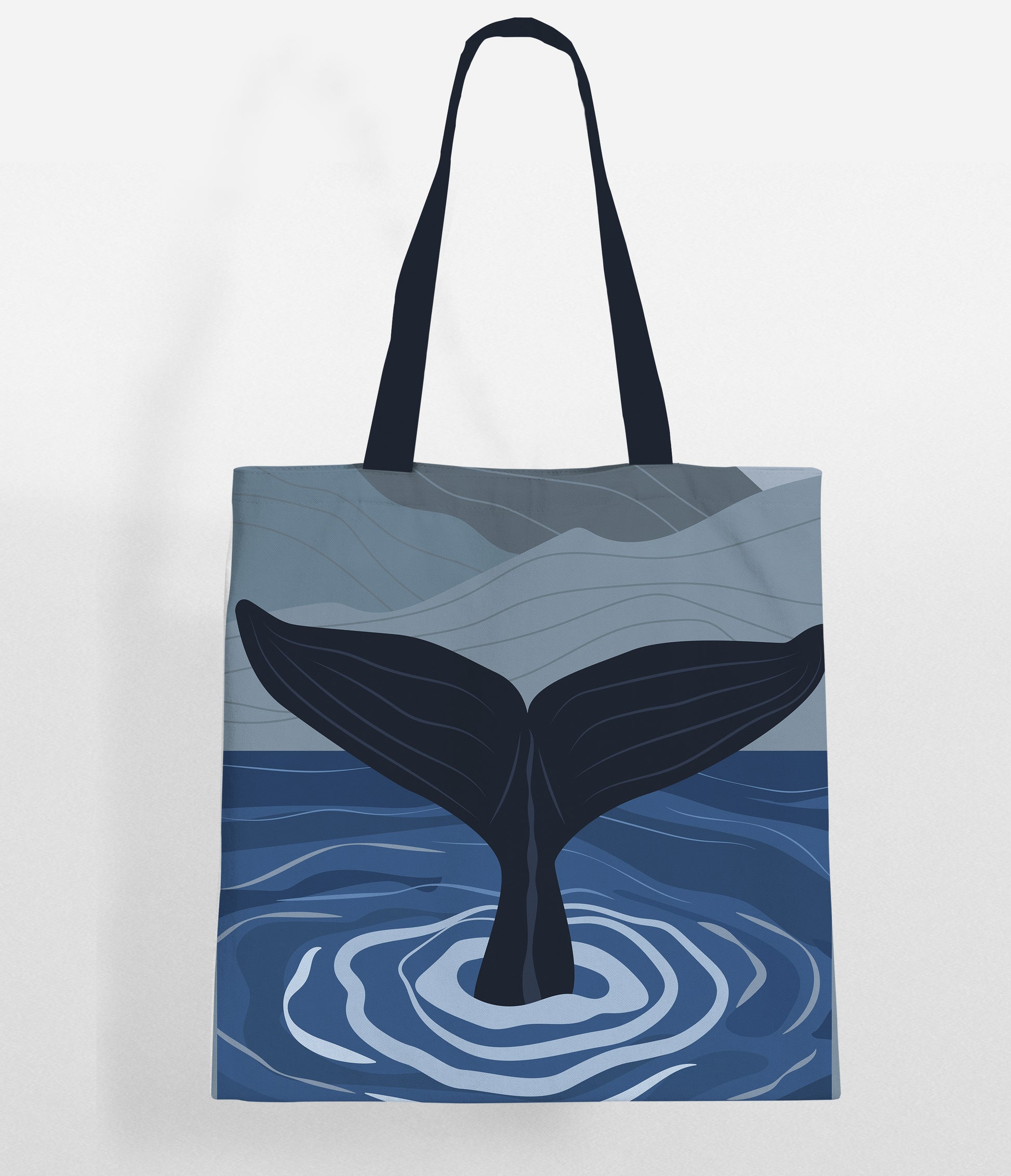  Cute whale design on a tote bag mockup by the sea.