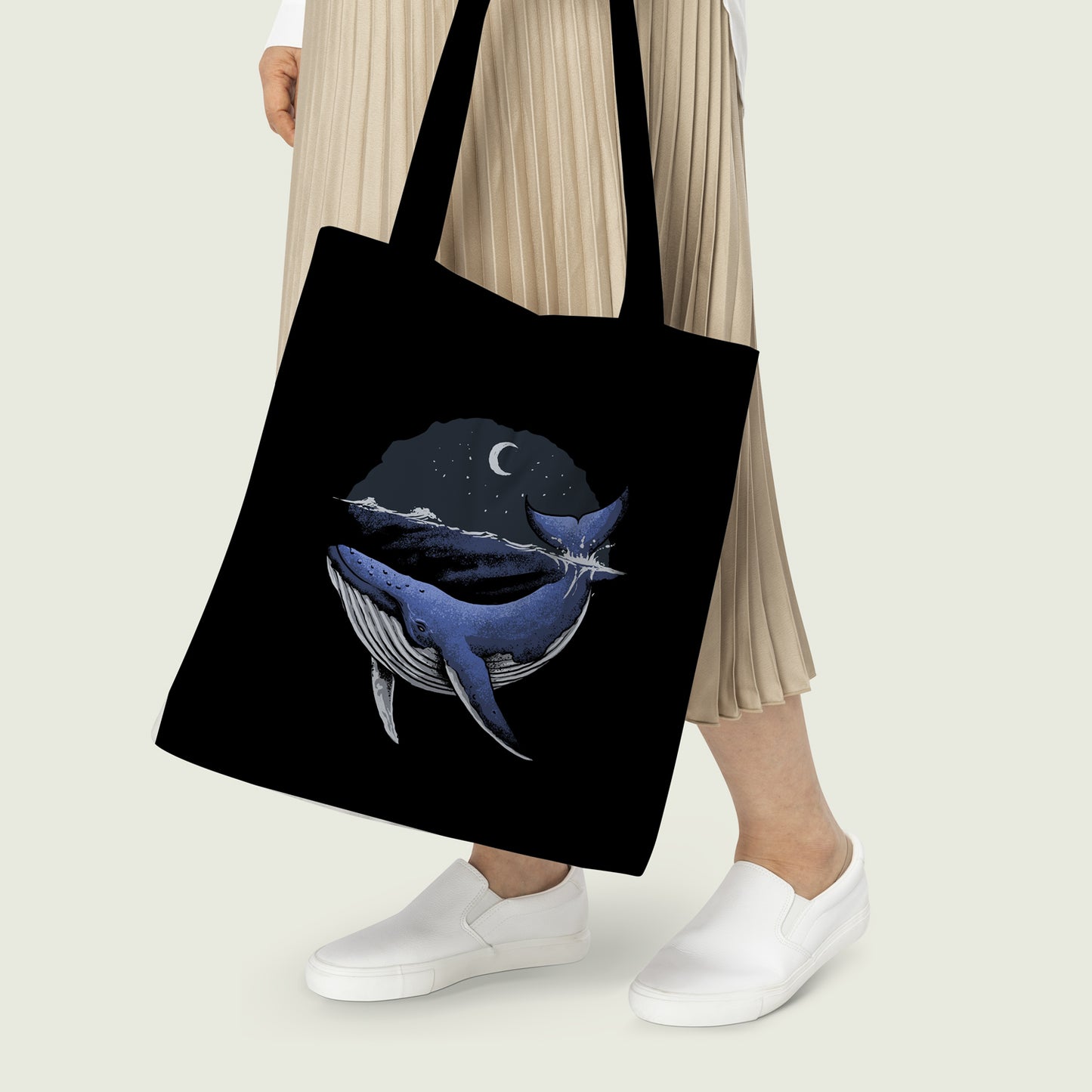  Stylish tote bag featuring a whale design with moon and stars, ideal for everyday use.