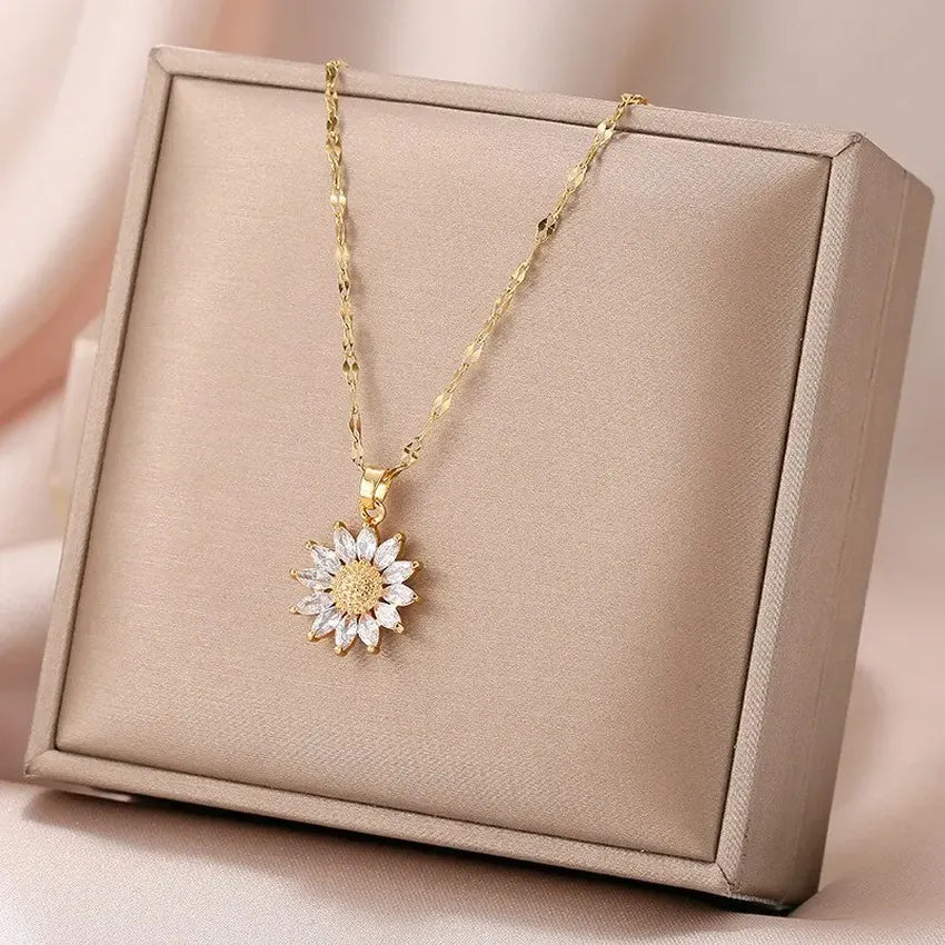 Elegant gold necklace featuring a charming sunflower pendant.